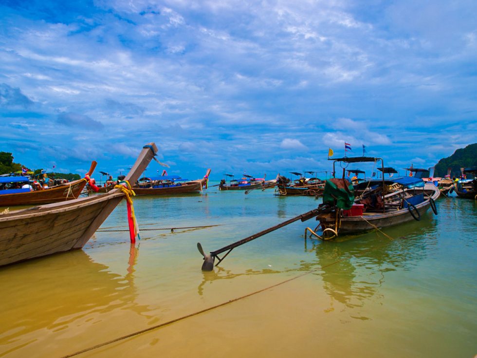 Boats on the Phi Phi Islands in Thailand during peak tourist season | Happymind Travels