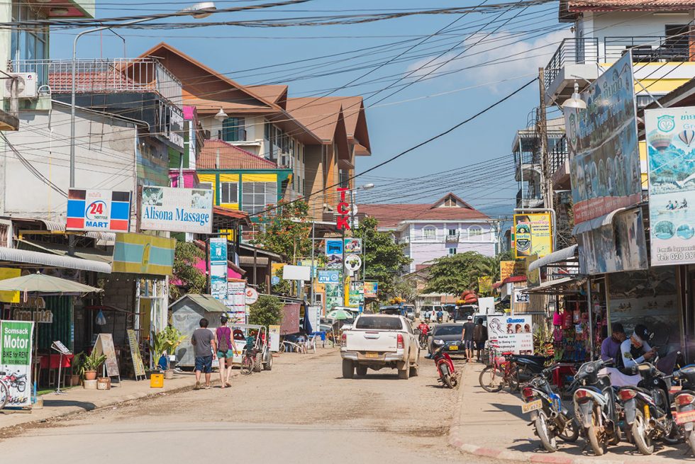 Main street of the small village of Vang Vieng in Laos | Happymind Travels